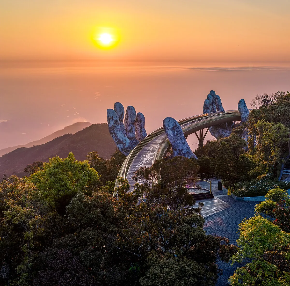 Golden Bridge Da Nang Vietnam stone hands holding path famous landmark