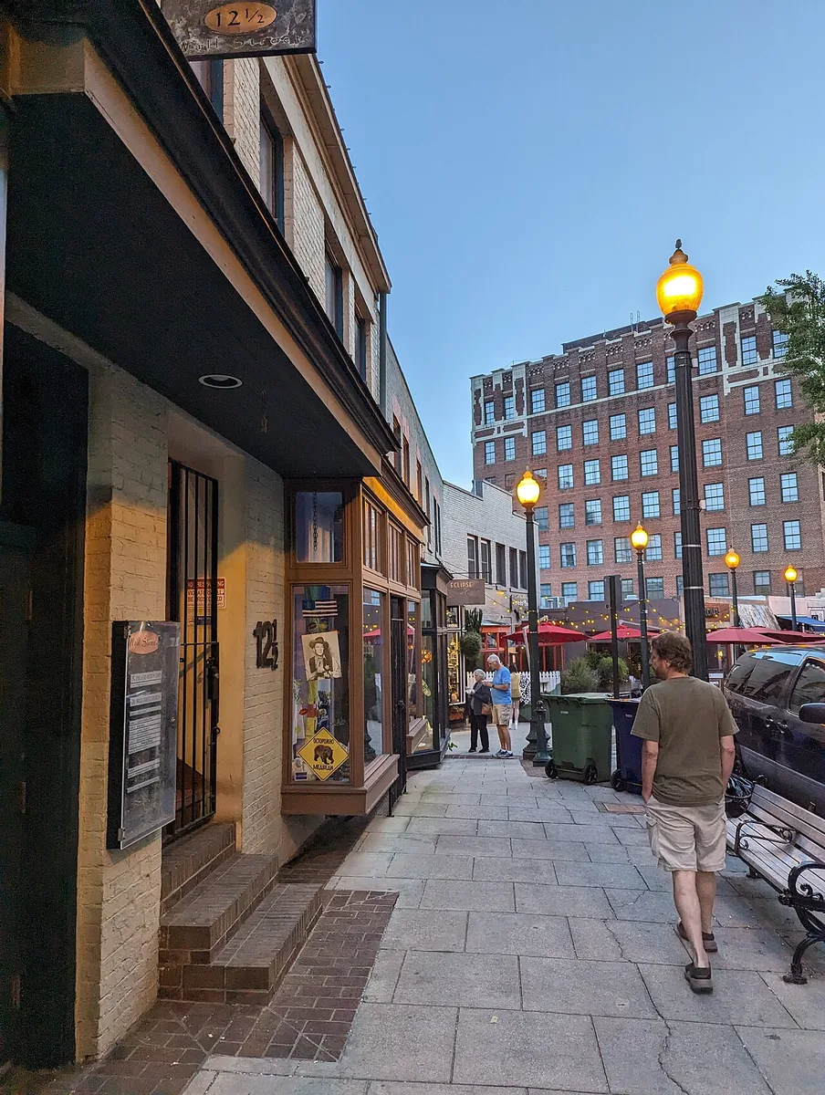 Where to Stay in Asheville, NC: Best Hotels and Areas (2026) 2 Asheville North Carolina downtown sidewalk shops restaurants Biltmore Village area