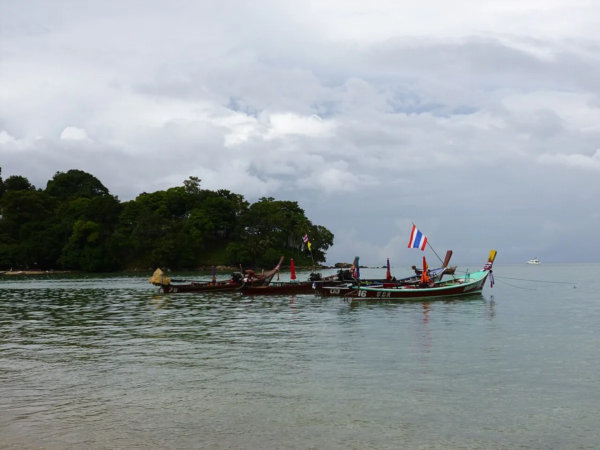 Best Things to Do in Phuket, Thailand (2026 Guide) 3 Long-tail boats Phuket Patong Beach Thailand island hopping activity